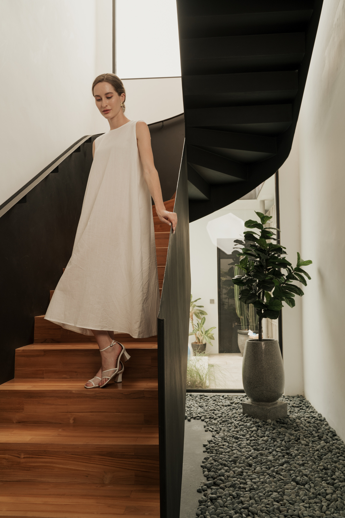 Elegant Woman Going Downstairs